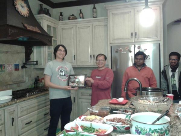 Dr. Liu Presenting Xiao his Graduation Present